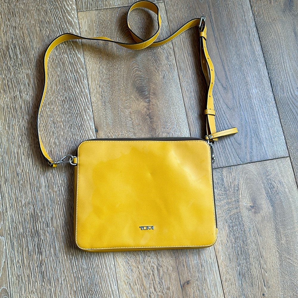 Tumi mustard colored crossbody